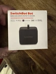 Switchbot Smart Button Pusher, Black. Fixed Price $14.99.